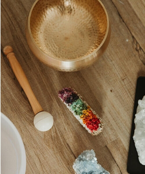 Somatic Sound Healing sound healing instruments on a wooden floor