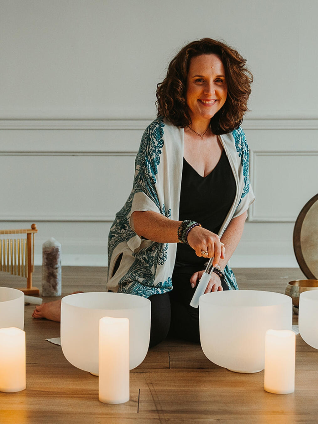 Berkeley Clements Owner Somatic Wellness Collective Berkeley playing crystal sound healing bowls